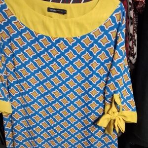 CANDY CONTEMPORARY ( as is) call- out on left sleeve -bow)